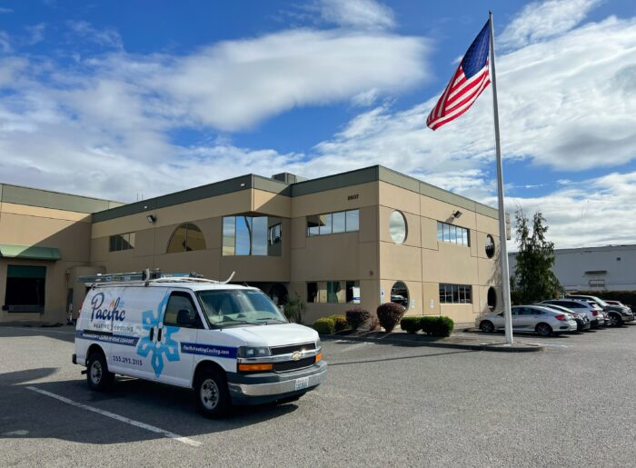 Pacific Heating and Cooling headquarters in Tacoma Wa with HVAC Service van parked out front