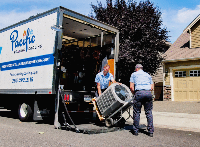 Unloading HVAC equipment. Heat Pump Installation. Cooling Upgrade. Air Conditioning Add-On, Upgraded Heat and Cool System