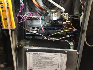 ennox furnace diagnostic code chart during heating system service call in Tacoma WA — Pacific Heating & Cooling technician