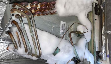 Frozen AC coil with ice buildup inside a Tacoma home air handler