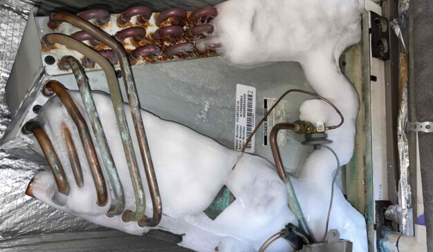 Frozen AC coil with ice buildup inside a Tacoma home air handler