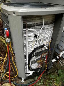 Frozen AC coil on outdoor condenser unit during repair service in Tacoma WA