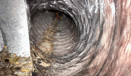 Dirty air duct coated in dust and debris affecting home air quality in Tacoma