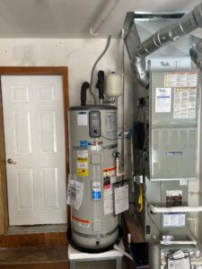 Bradford White AeroTherm heat pump water heater installed alongside an American Standard furnace in a Tacoma WA home