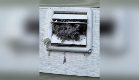 Clogged dryer vent covered in lint before a Tacoma cleaning visit Placement: directly under the H1, above the opening paragraph Why hero: it's a real, striking 
