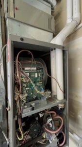 Inside an HVAC system during a Pacific maintenance tune-up in Tacoma