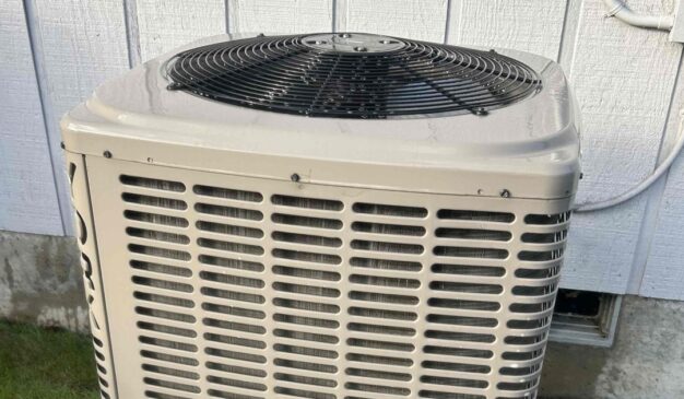 Outdoor AC condenser running during bad air quality at a Tacoma home